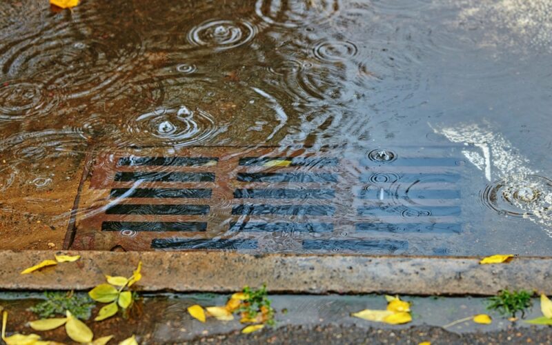 Flooding,Across,Road,During,Rain,,Blocked,Street,Drain.,Plumbing,Problems